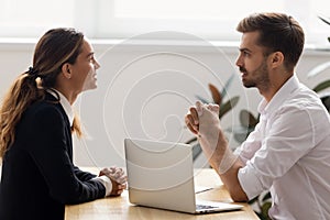 Male hr employer talk to female applicant at job interview photo