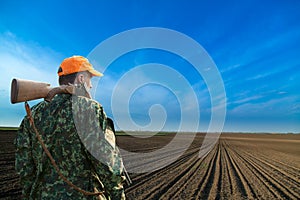 Male hunter looking at field during hunt season.