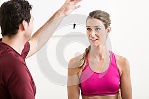 Male instructor hypnotizing female