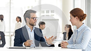 Male insurance broker or bank manager consulting client making offer