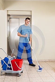 Male Janitor Mopping Floor