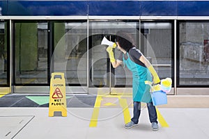 Male janitor uses a megaphone in the train station