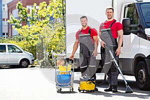 Male Janitors With Cleaning Equipment