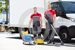 Male Janitors With Cleaning Equipment photo