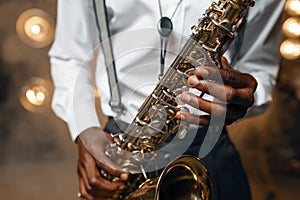 Male jazz performer plays the saxophone on stage