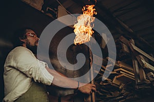 A male joiner works in the workshop.