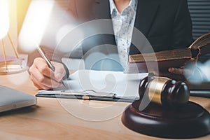 Male judge working with contract papers on white wooden table in courtroom