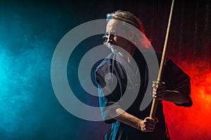 Male kendo fighter with bamboo sword shinai