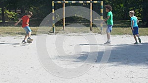 Male kids playing street football game having fun outdoors, sport hobby, leisure