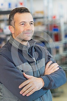 Male laborer posing and smiling confidently