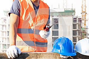 Male laborers are working in the building construction site