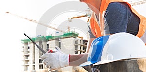 Male laborers are working in the building construction site.