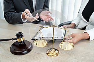 Male lawyer and Businesswoman working consulting and negotiation having team meeting at a law firm in the office