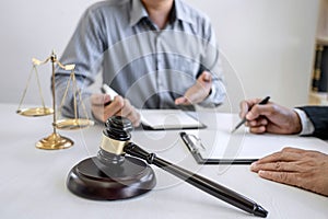 Male lawyer or Counselor working in courtroom have meeting with client are consultation with contract papers of real estate, Law