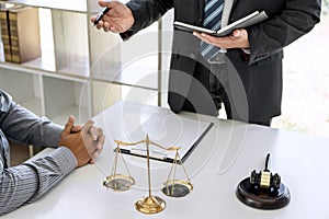 Male lawyer or Counselor working in courtroom have meeting with client are consultation with contract papers of real estate, Law