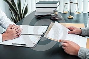 Male lawyer discussing negotiation legal case with client meeting with document contract in office, law and justice, attorney,