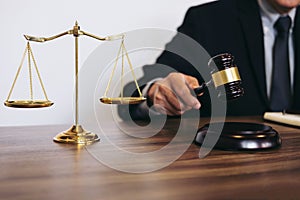 Male lawyer or judge working with Law books, gavel, report the c