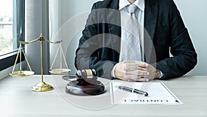 Male lawyer working with legal case document contract in office
