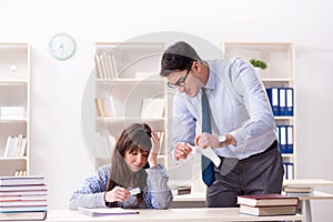 The male lecturer giving lecture to female student