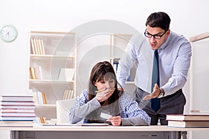 The male lecturer giving lecture to female student