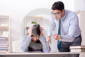 The male lecturer giving lecture to female student