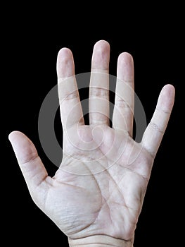 Male left hand palm with black background