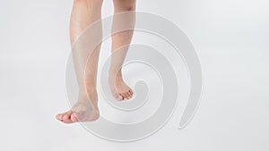 Male legs and barefoot is isolated on white background