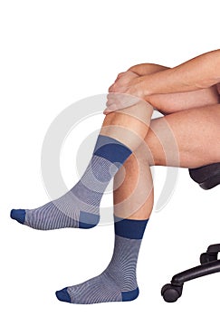 Male legs in blue socks. Isolated on white background.