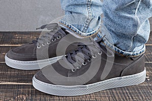 Male legs with gray nubuck leather shoes, concept