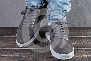 Male legs with gray nubuck leather shoes, concept, as if walking