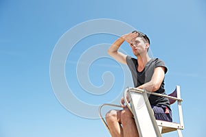 Male lifeguard looking in anticipation photo
