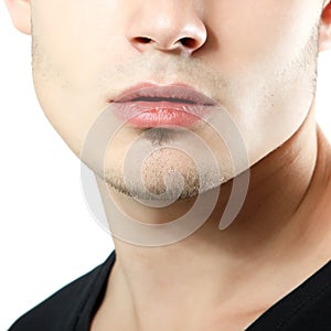 Male lips, chin and cheekbone coseup, face detail of young man photo