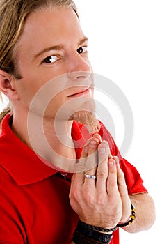 Male looking at camera while praying