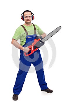 Male lumberyard worker with chainsaw