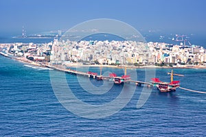 Male Maldives capital city island sea bridge aerial photo