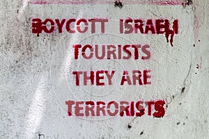 MALE, MALDIVES - JULY 11, 2016: Writing Boycott Israeli tourists, they are terrorists on a wall in Male, Maldive