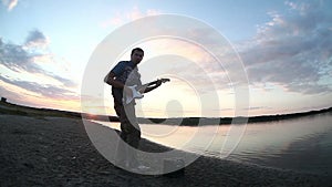 Male man guitarist street musician playing the