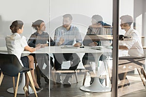 Male manager boss talking at group office meeting in boardroom