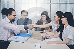 Male manager with colleague in meeting business