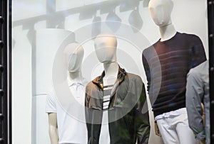 Male mannequins in the store window