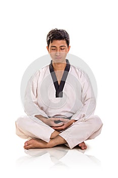 Male martial artist meditates, portrait on white background