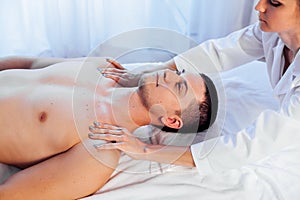 Male masseur doing massage in the Spa