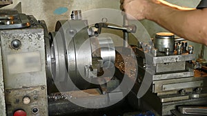 Male Mechanic at Work at the Lathe