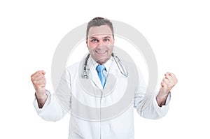 Male medic or doctor feeling winner, enthusiastic and happy