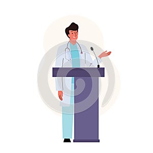 Male medical doctor standing at podium and giving a speech at a medicine conference. Presentation scientific research