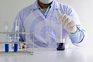 Male medical or scientific laboratory researcher performs tests