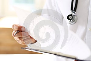 Male medicine doctor hand holding silver pen