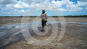 Male member of the military forces in Mocimboa da Praia, located in the Cabo Delgado region photo
