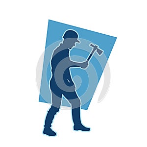 male miner. construction worker holding an adze hatchet axe vector silhouette.