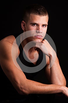 male model with a black singlet